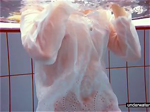 uber-cute red-haired plays naked underwater